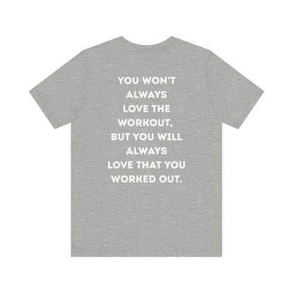 Gray t-shirt with motivational quote on the back against a white background