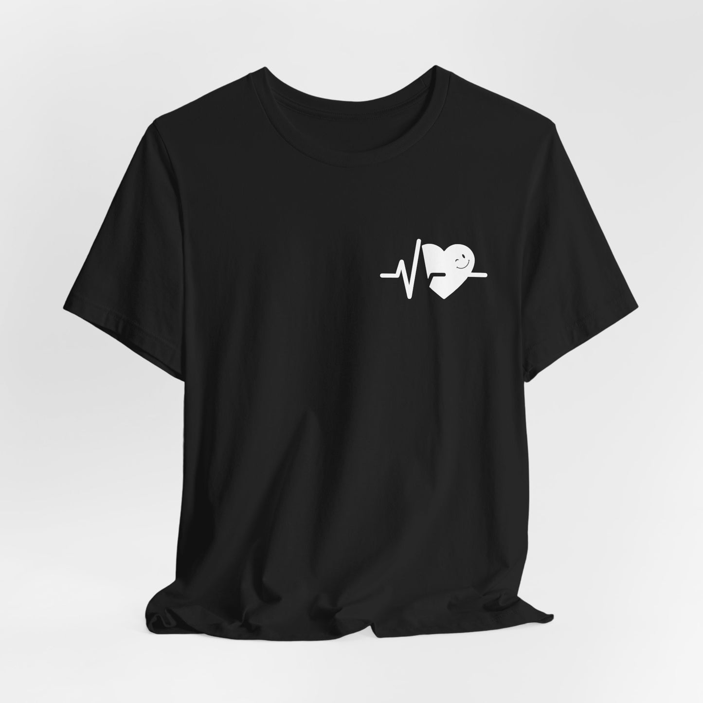Black t-shirt with a white heart and line design on a light gray background
