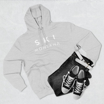 Gray hoodie with 'Ski Montana' text, black jeans, and black sneakers on a light gray background