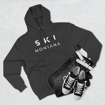 Dark gray hoodie with 'Ski Montana' text, black jeans, and black sneakers on a light gray background